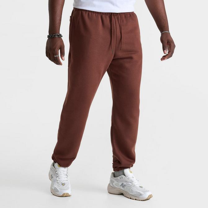 [angle] view of Men's New Balance Sport Essentials Fleece Jogger Pants in Rich Oak Click to zoom