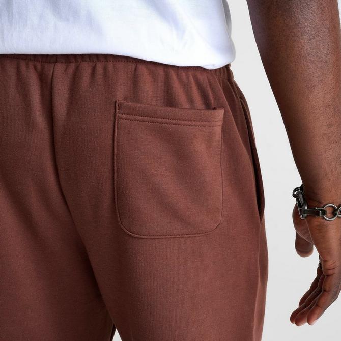 [angle] view of Men's New Balance Sport Essentials Fleece Jogger Pants in Rich Oak Click to zoom