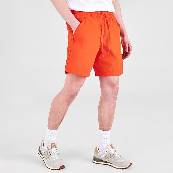 Back Left view of Men's New Balance Athletics Wind Shorts in Poppy Click to zoom