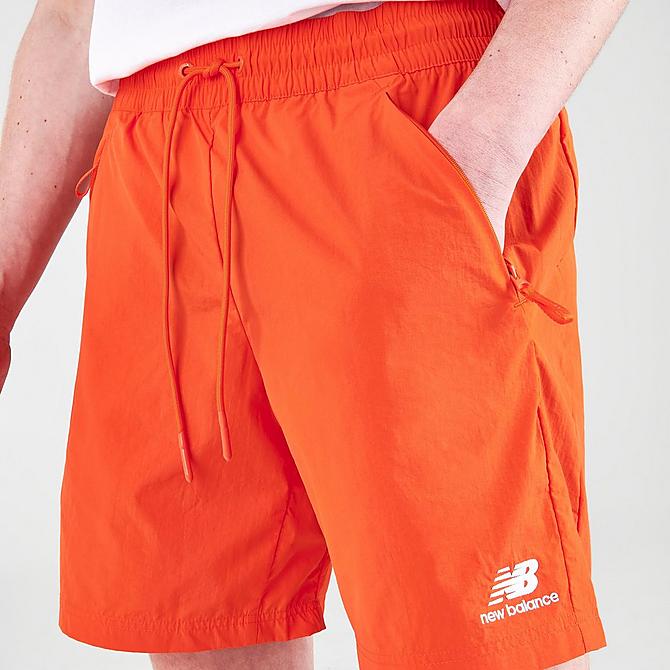 On Model 5 view of Men's New Balance Athletics Wind Shorts in Poppy Click to zoom