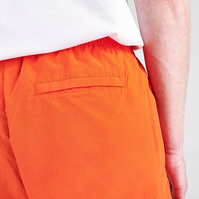 On Model 6 view of Men's New Balance Athletics Wind Shorts in Poppy Click to zoom