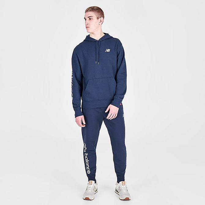 Front Three Quarter view of Men's New Balance NB Essentials Metallic Pullover Hoodie in Navy Click to zoom