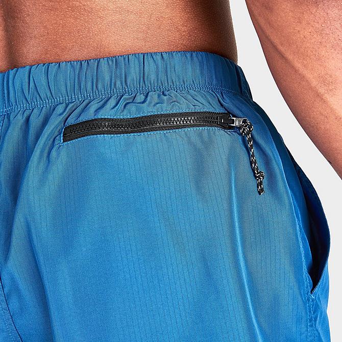 On Model 6 view of Men's Nike Packable Cargo Volley 5-Inch Swim Shorts in Dark Marina Blue Click to zoom