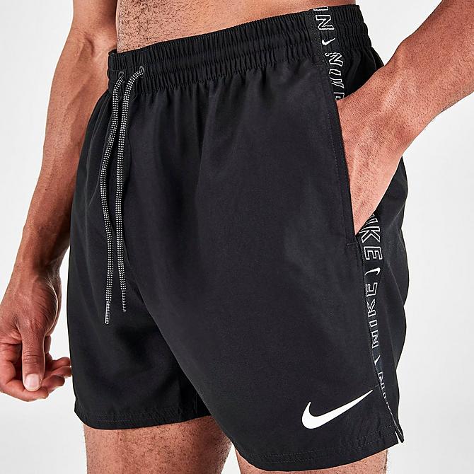 On Model 5 view of Men's Nike Swoosh Logo Taped 5-Inch Volley Swim Shorts in Black Click to zoom