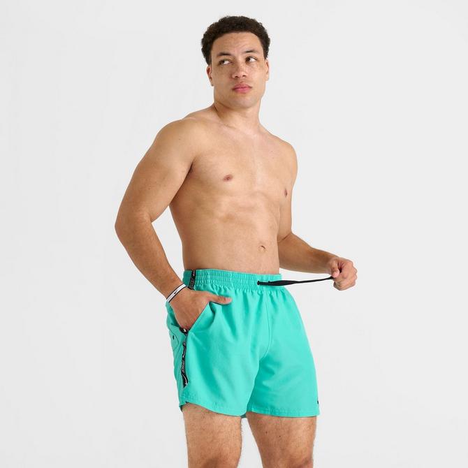 [angle] view of Men's Nike Swim Tape Logo 5" Volley Shorts in Hyper Jade Click to zoom