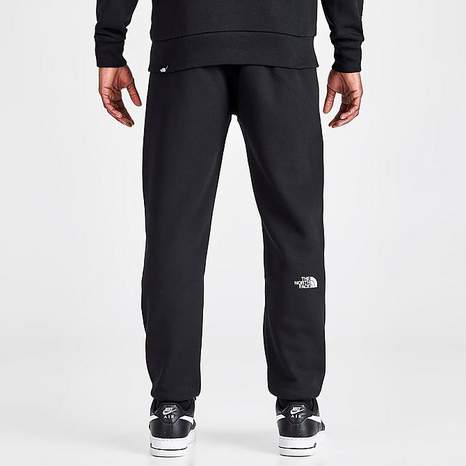 Back Right view of Men's The North Face Linear Graphic Track Pants in Black Click to zoom