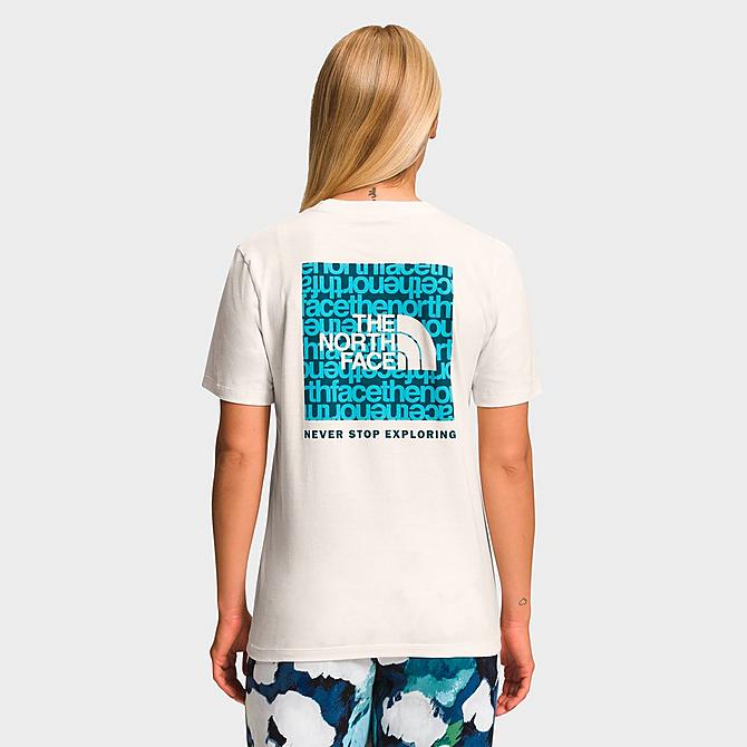 Front Three Quarter view of Women's The North Face NSE Logo T-Shirt in Gardenia White/Blue Coral TNF Lowercase Print Click to zoom