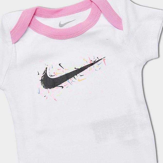 Left view of Girls' Infant Nike Swoosh Pop Bodysuit, Bib and Headband Gift Box Set (3-Piece) in White/Pink/Black Click to zoom