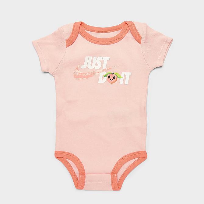 Three Quarter view of Infant Nike Lil Peach Bodysuit, Headband and Bib Box Set (3-Piece) in Atmosphere Click to zoom