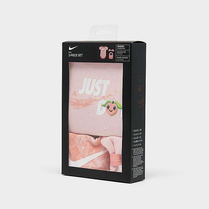 Left view of Infant Nike Lil Peach Bodysuit, Headband and Bib Box Set (3-Piece) in Atmosphere Click to zoom