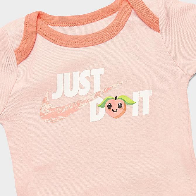 Back view of Infant Nike Lil Peach Bodysuit, Headband and Bib Box Set (3-Piece) in Atmosphere Click to zoom