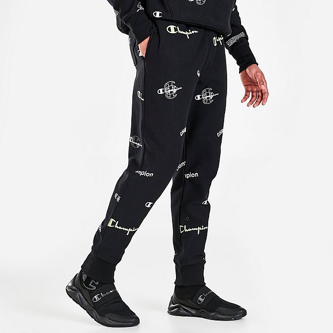 Back Left view of Men's Champion Reverse Weave Allover Logo Print Jogger Pants in Black Click to zoom