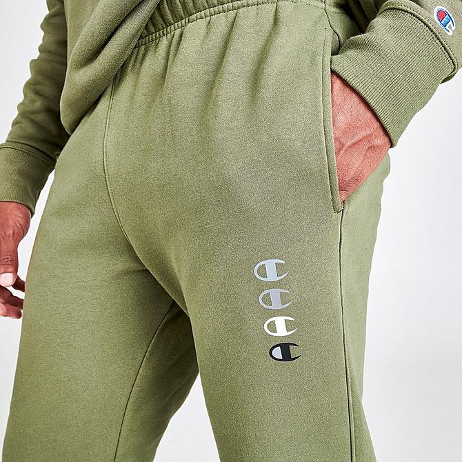 On Model 6 view of Men's Champion Triple Logo Jogger Pants in Cargo Olive Click to zoom