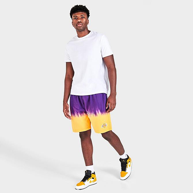 Front Three Quarter view of Men's Mitchell & Ness Los Angeles Lakers NBA Tie-Dye Fleece Shorts in Yellow/Purple Click to zoom