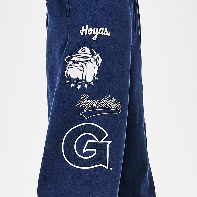 On Model 6 view of Men's Mitchell & Ness Georgetown Hoyas College Champs Jogger Pants in Navy Click to zoom