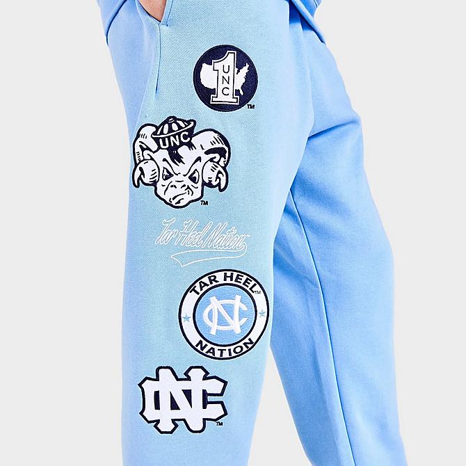 On Model 5 view of Men's Mitchell & Ness University of North Carolina Tar Heels College Champs Jogger Pants in Carolina Blue Click to zoom