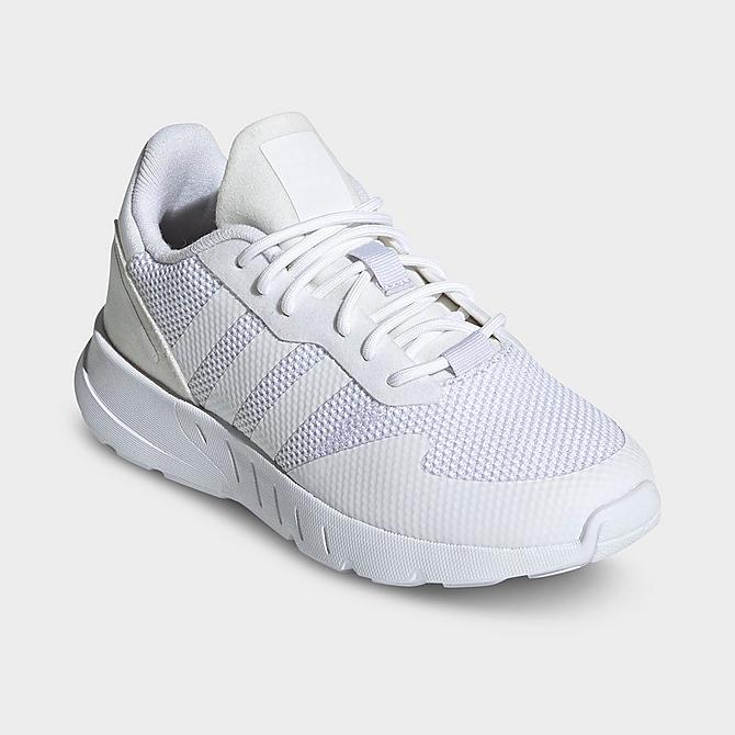 Three Quarter view of Little Kids' adidas Originals ZX 1K BOOST Casual Shoes in White/White/White Click to zoom