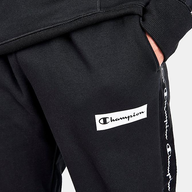 On Model 5 view of Men's Champion Classic Fleece Taped Jogger Pants in Black Click to zoom