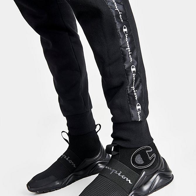On Model 6 view of Men's Champion Classic Fleece Taped Jogger Pants in Black Click to zoom