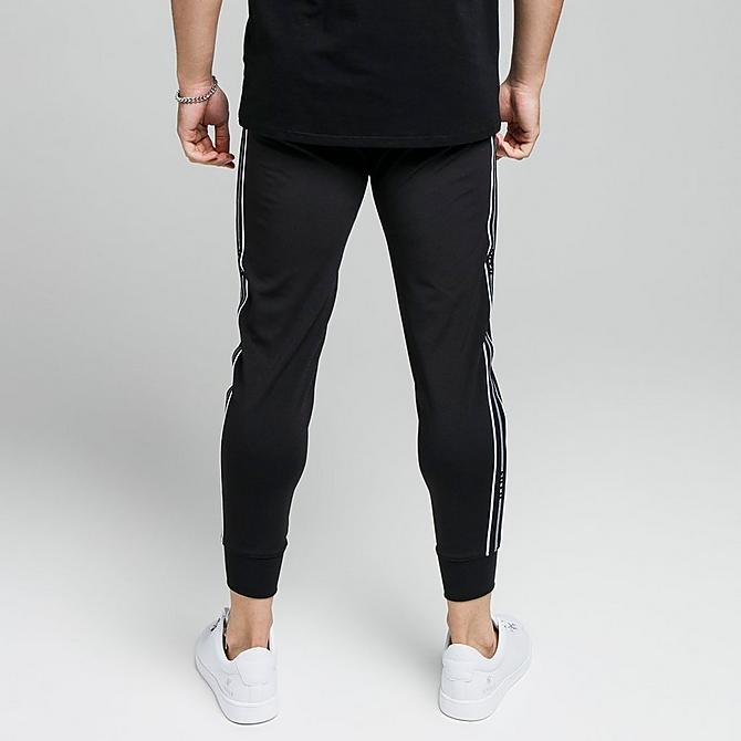 On Model 5 view of Men's SikSilk Status Taped Jogger Pants in Black Click to zoom