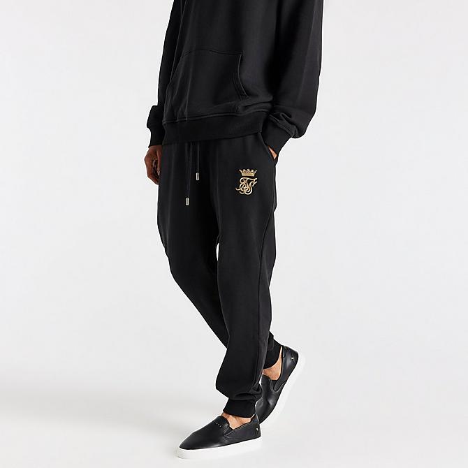 Front Three Quarter view of Men's Messi x SikSilk Fleece Jogger Pants in Black/Gold Click to zoom