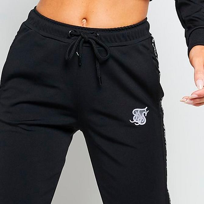 On Model 5 view of Women's SikSilk Logo Tape Jogger Pants in Black/White Click to zoom