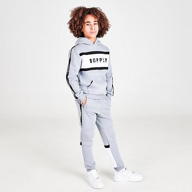Front view of Boys' Supply & Demand Stripe Taped Colorblock Jogger Pants in Light Grey Click to zoom