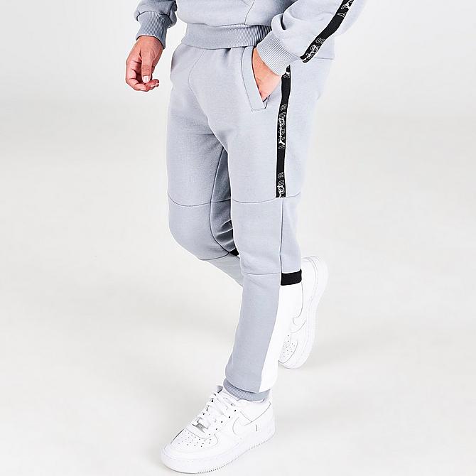 Back Left view of Boys' Supply & Demand Stripe Taped Colorblock Jogger Pants in Light Grey Click to zoom
