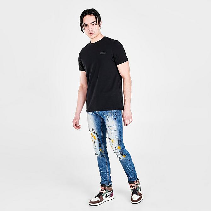 Front Three Quarter view of Men's Supply & Demand Paint Splatter Jeans in Indigo Click to zoom