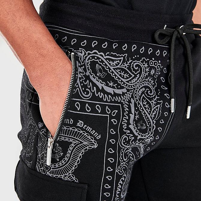 On Model 5 view of Men's Supply & Demand Dropper Woven Cargo Shorts in Black Click to zoom