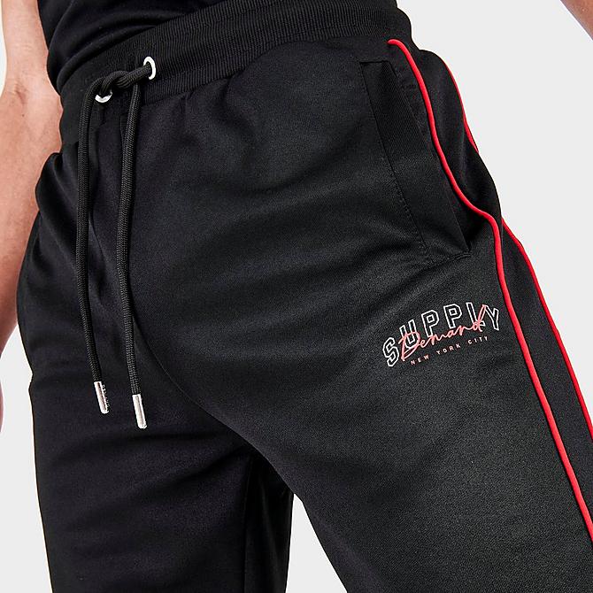 On Model 5 view of Men's Supply & Demand Stadium Track Jogger Pants in Black Click to zoom