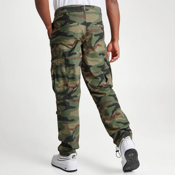 FIRST ROW: SLIM FIT CAMO PANTS