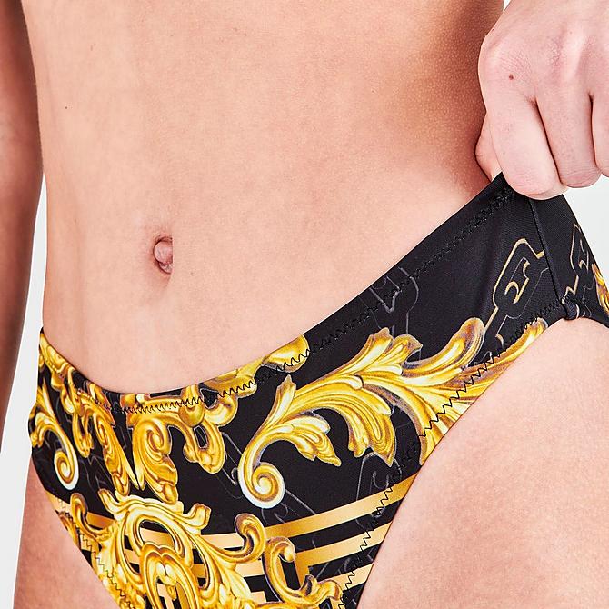 On Model 5 view of Women's Supply & Demand Regal Bikini Bottoms in Black/Gold Click to zoom