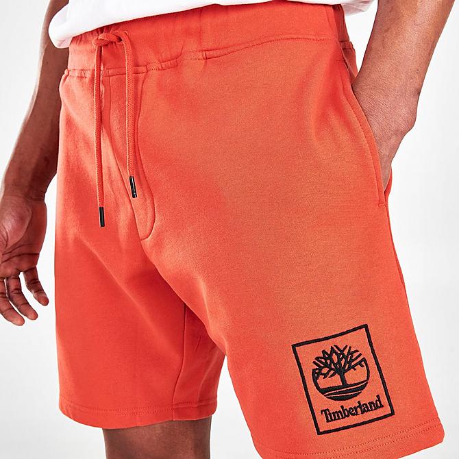 On Model 5 view of Men's Timberland Stack Logo Sweatshorts in Burnt Ochre Click to zoom