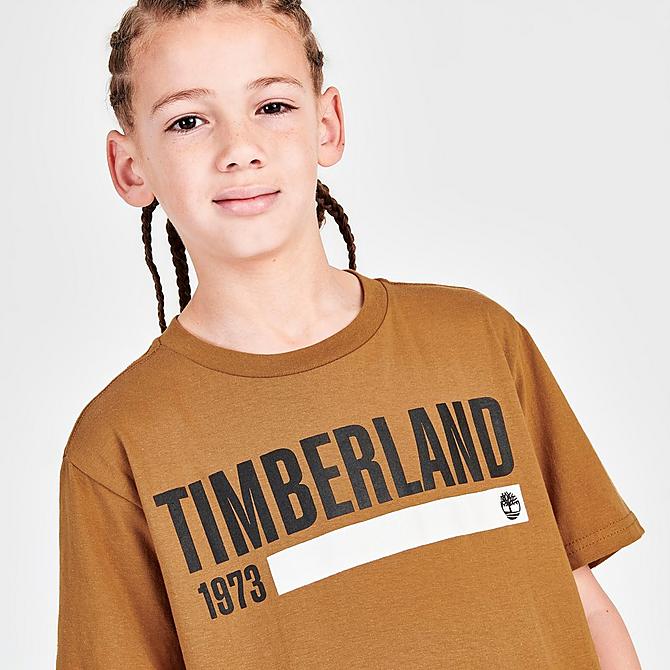 On Model 5 view of Kids' Timberland Work Logo T-Shirt in Wheat Click to zoom