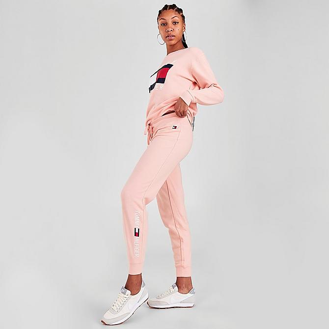 Front Three Quarter view of Women's Tommy Hilfiger Printed Logo Jogger Pants in Tropical Peach Click to zoom