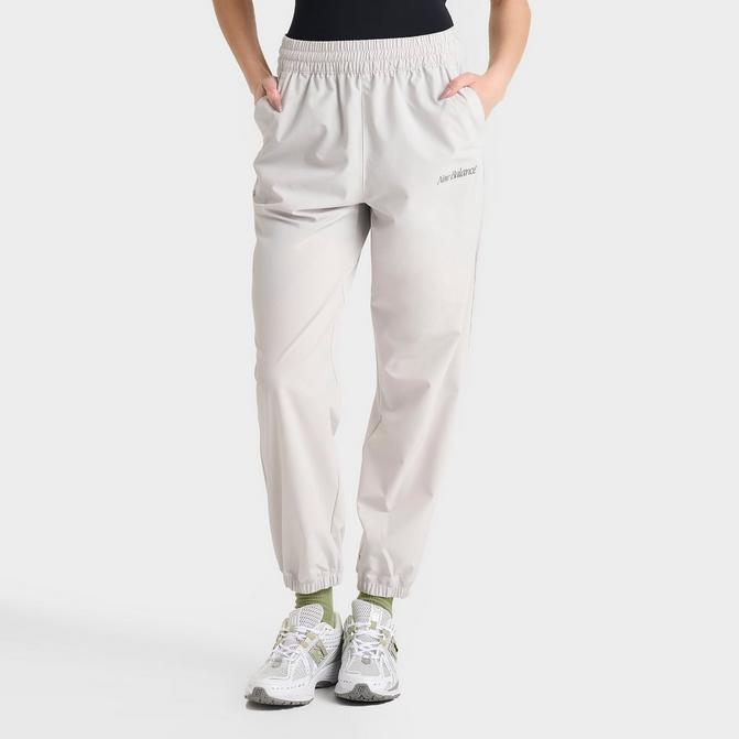 [angle] view of Women's New Balance Athletics Stretch Woven Jogger Pants in Grey Matter Click to zoom