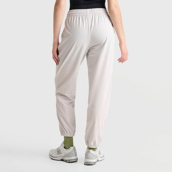 [angle] view of Women's New Balance Athletics Stretch Woven Jogger Pants in Grey Matter Click to zoom