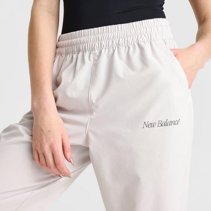 [angle] view of Women's New Balance Athletics Stretch Woven Jogger Pants in Grey Matter Click to zoom