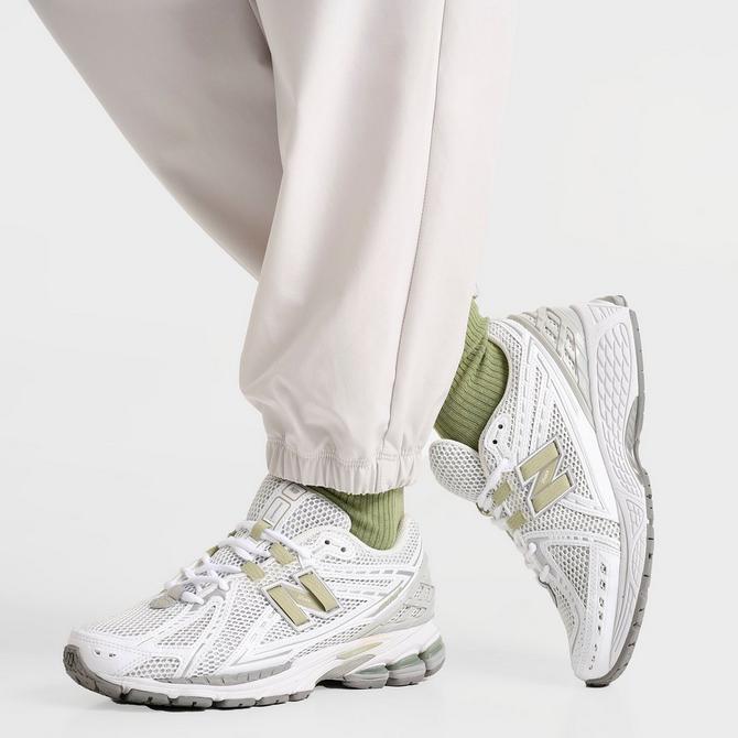 [angle] view of Women's New Balance Athletics Stretch Woven Jogger Pants in Grey Matter Click to zoom