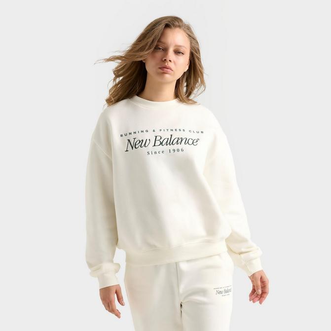 [angle] view of Women's New Balance Logo Crewneck Sweatshirt in Salt/Spruce Click to zoom