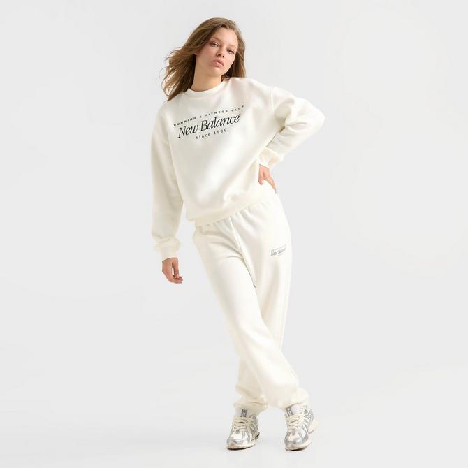 [angle] view of Women's New Balance Logo Crewneck Sweatshirt in Salt/Spruce Click to zoom