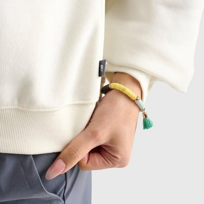 [angle] view of Women's New Balance Logo Crewneck Sweatshirt in Salt/Spruce Click to zoom