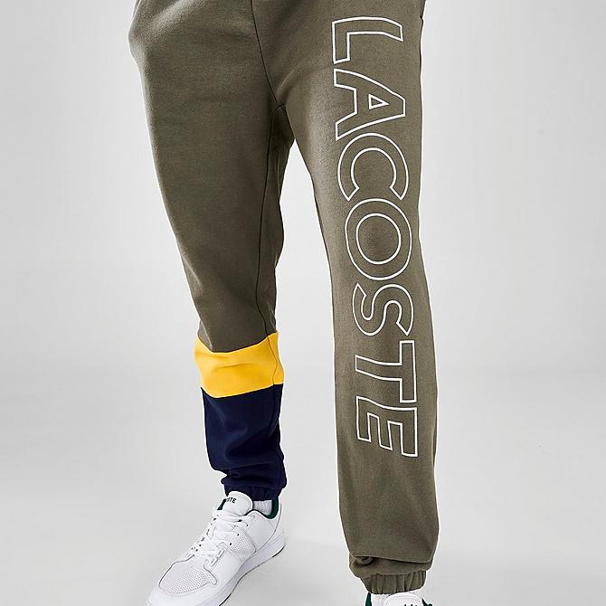 On Model 6 view of Men's Lacoste Colorblock Jogger Pants in Tank/Anthemis/Scille Click to zoom