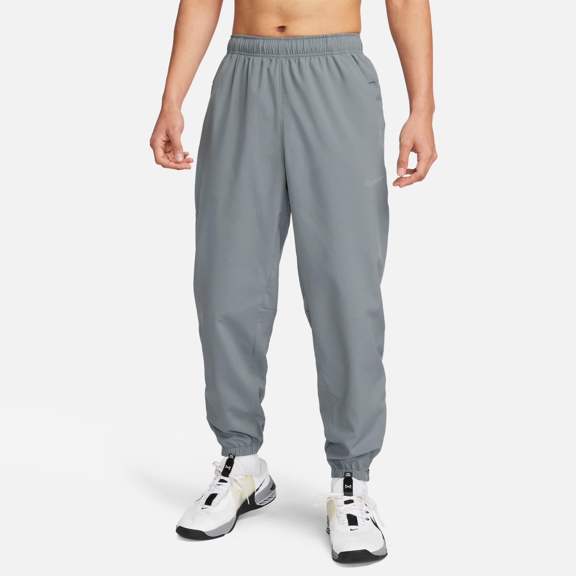 Nike Men's Form Dri-FIT Tapered Versatile Pants in SMOKE GREY/BLACK/(RE Size: XS