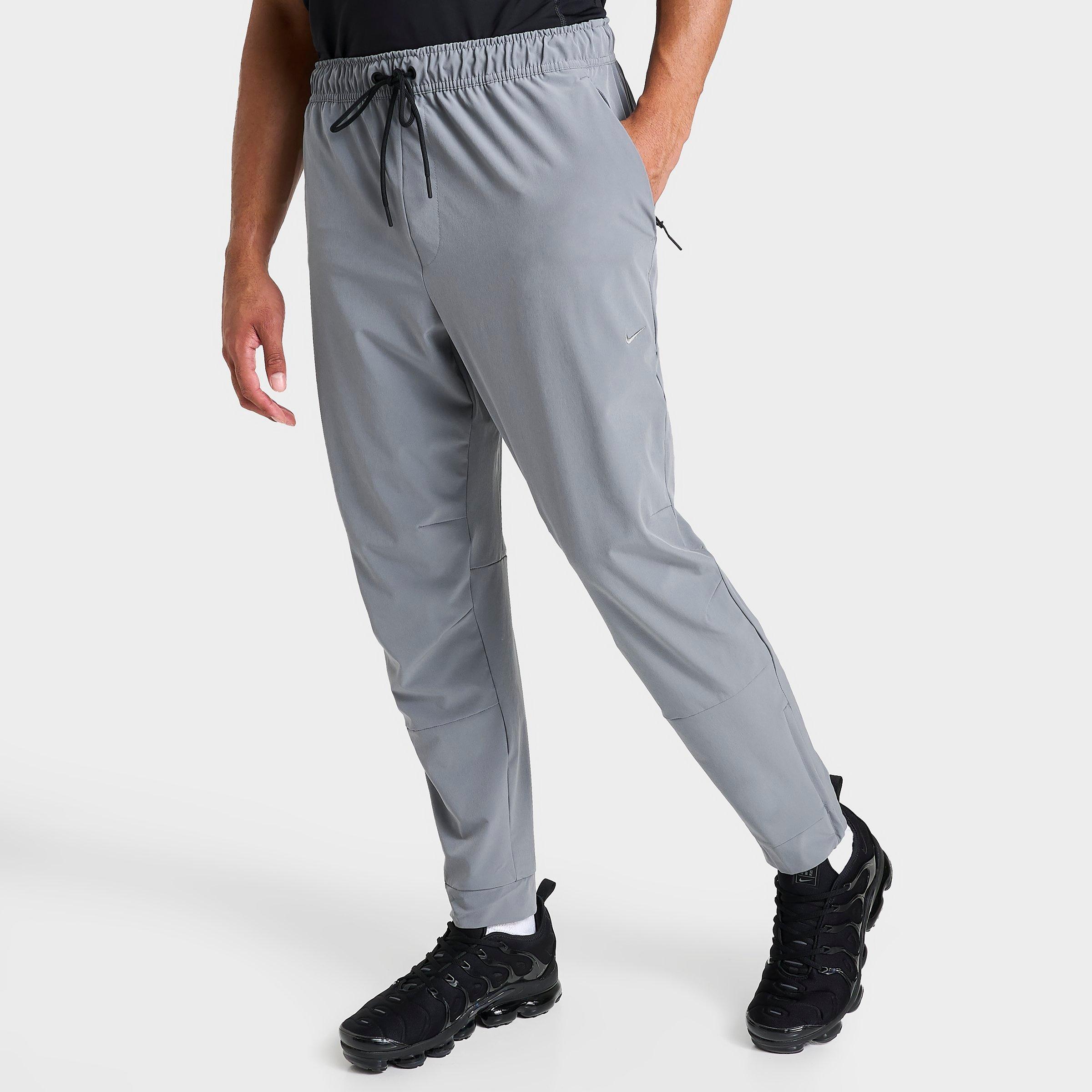 Nike Men's Dri-fit Unlimited Tapered Leg Versatile Training Pants In Smoke Grey/black/smoke Grey