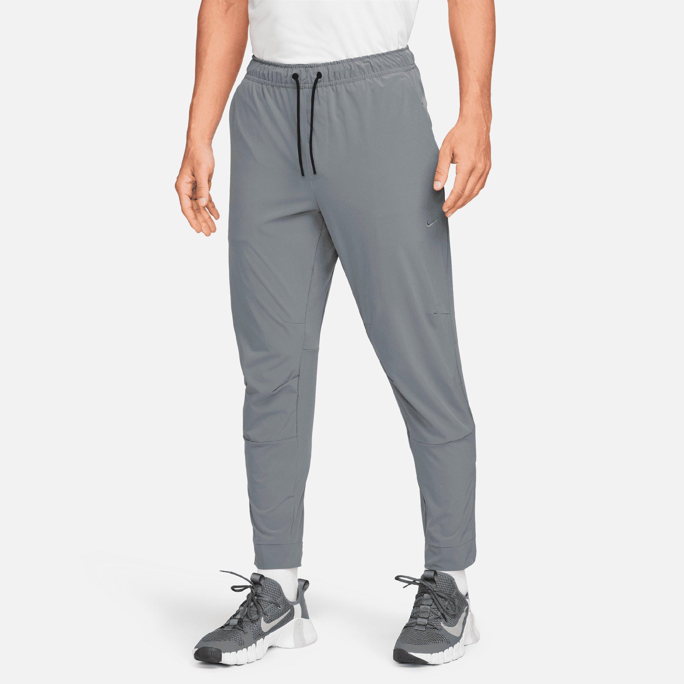 Nike Men's Dri-fit Unlimited Tapered Leg Versatile Training Pants In Smoke Grey/black/smoke Grey