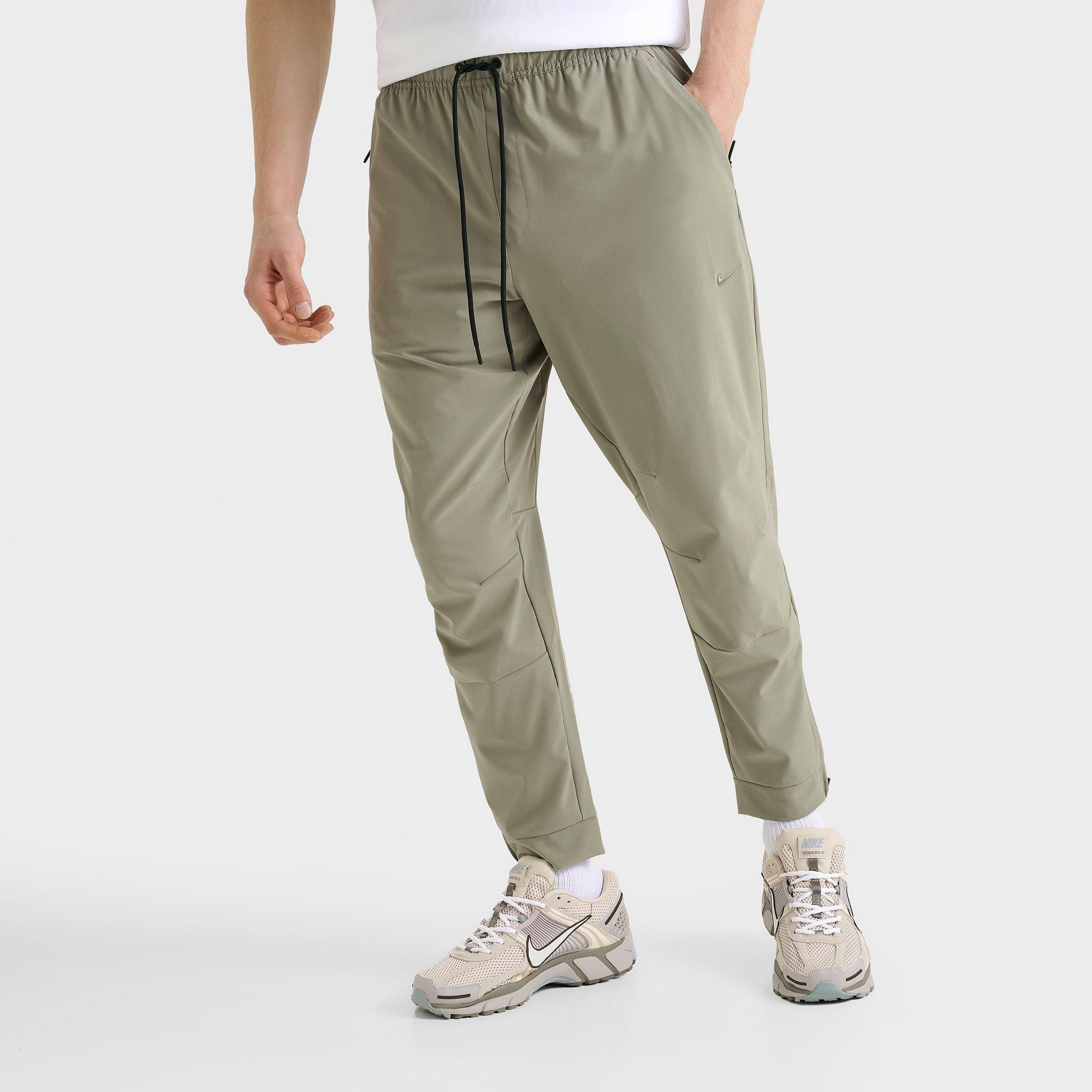 Nike Men's Dri-FIT Unlimited Tapered Leg Versatile Training Pants in Green/Light Army Size Small Polyester/Spandex