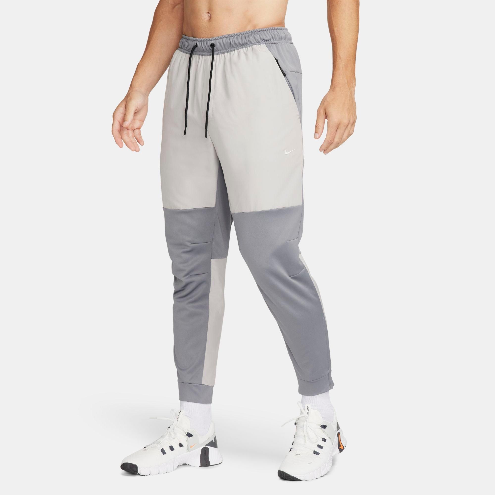 Shop Nike Men's Unlimited Water-repellent Tapered Versatile Pants In Smoke Grey/light Iron Ore/light Iron Ore