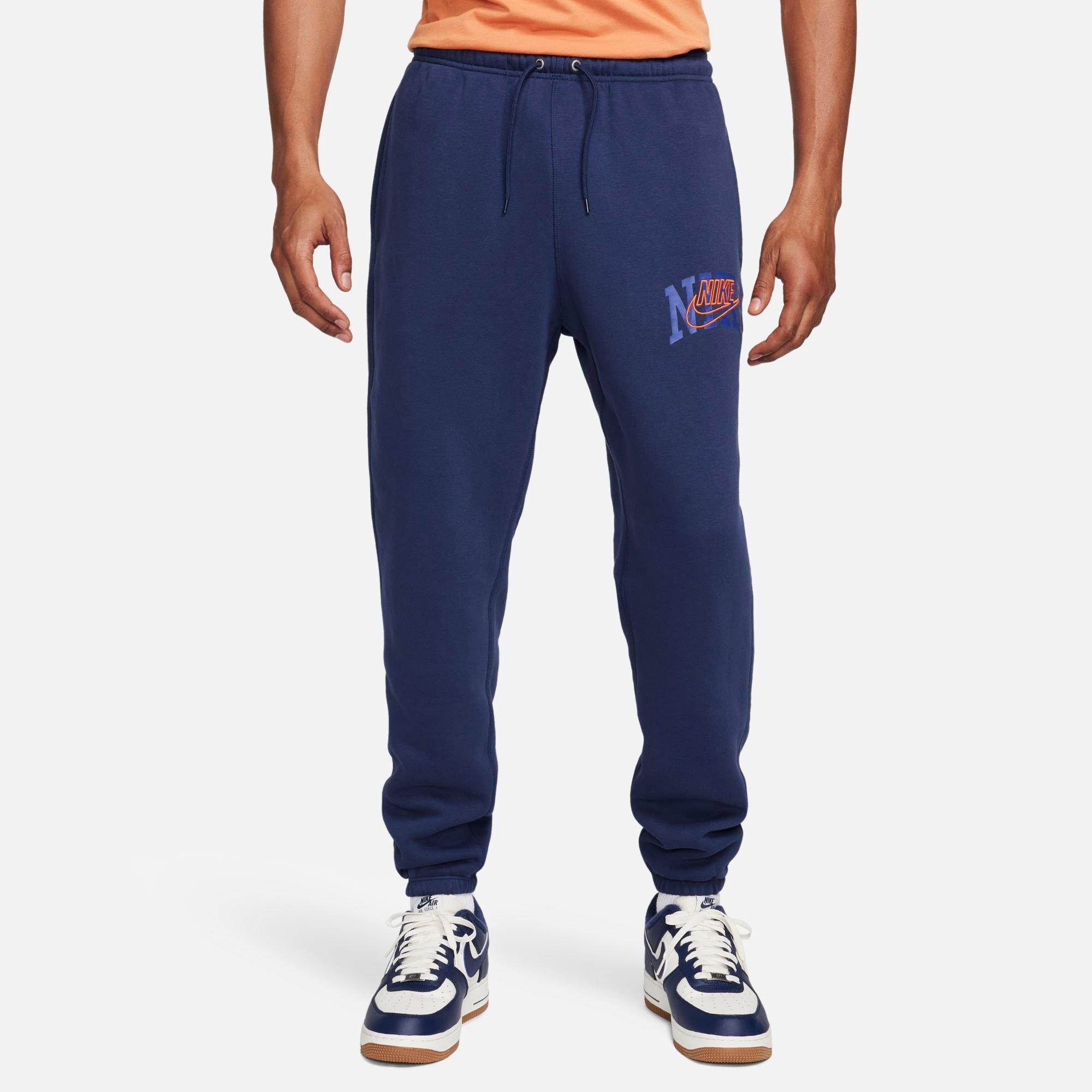 Shop Nike Men's Club Fleece Arched Varsity Graphic Cuffed Sweatpants In Midnight Navy/safety Orange
